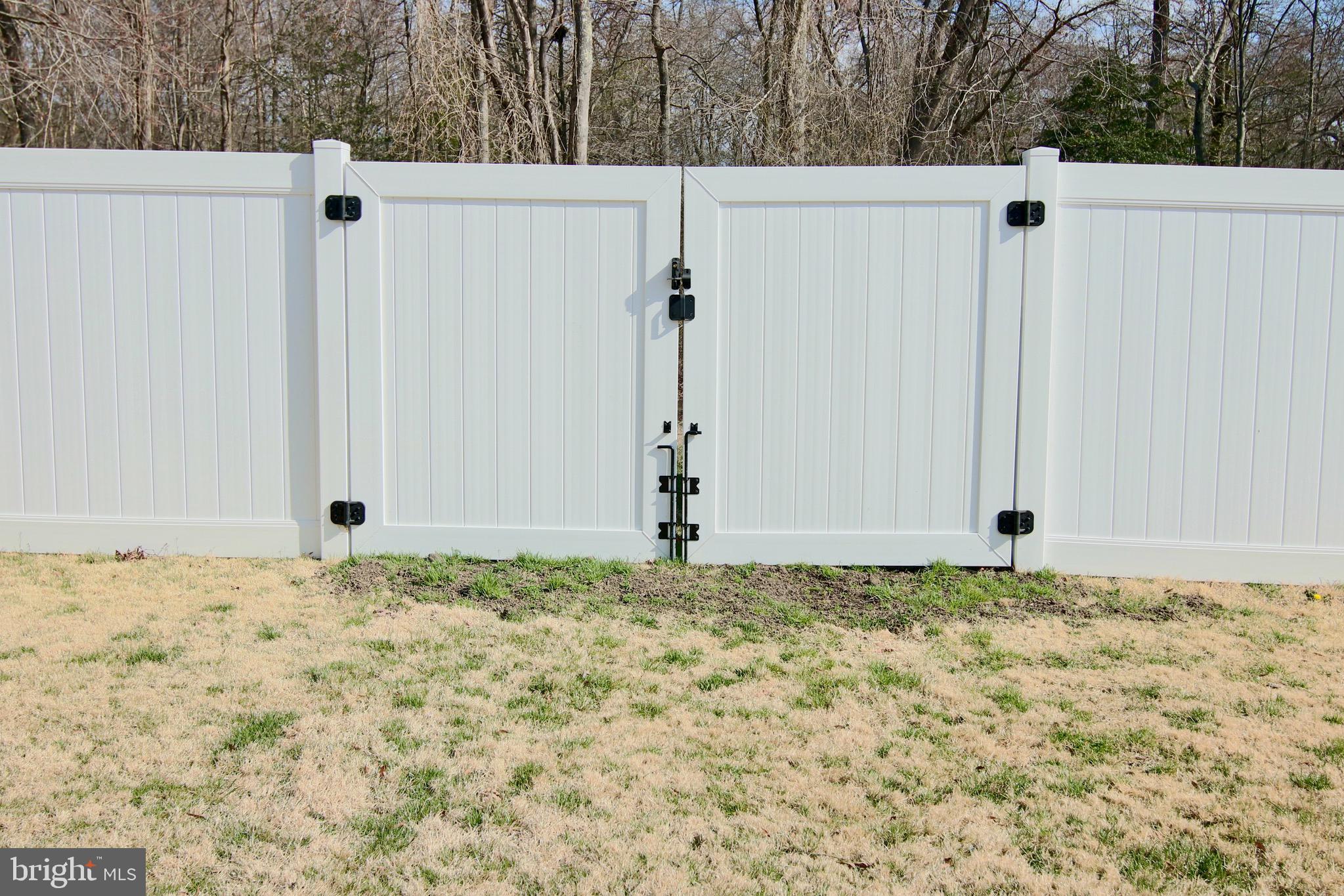 8310 Risha Drive Severn, MD 21144 - Photo 45 of 48 Vinyl Privacy Fence with wide gates