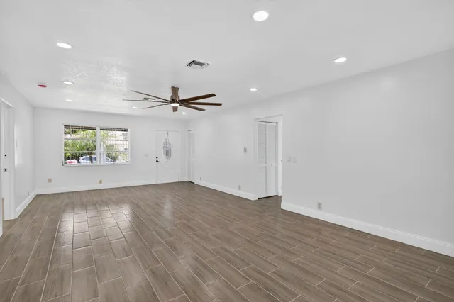 a kitchen with stainless steel appliances a refrigerator sink and stove