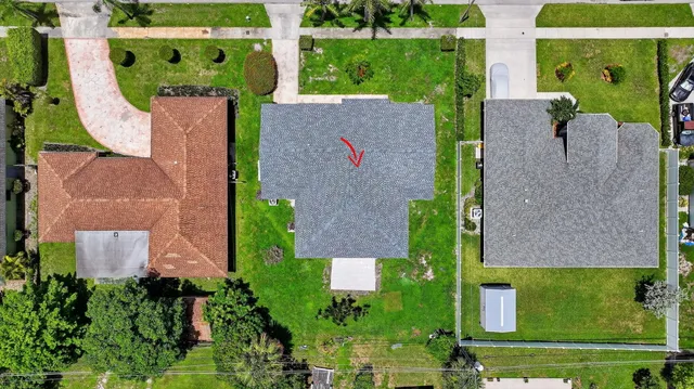 a view of a swimming pool in a backyard