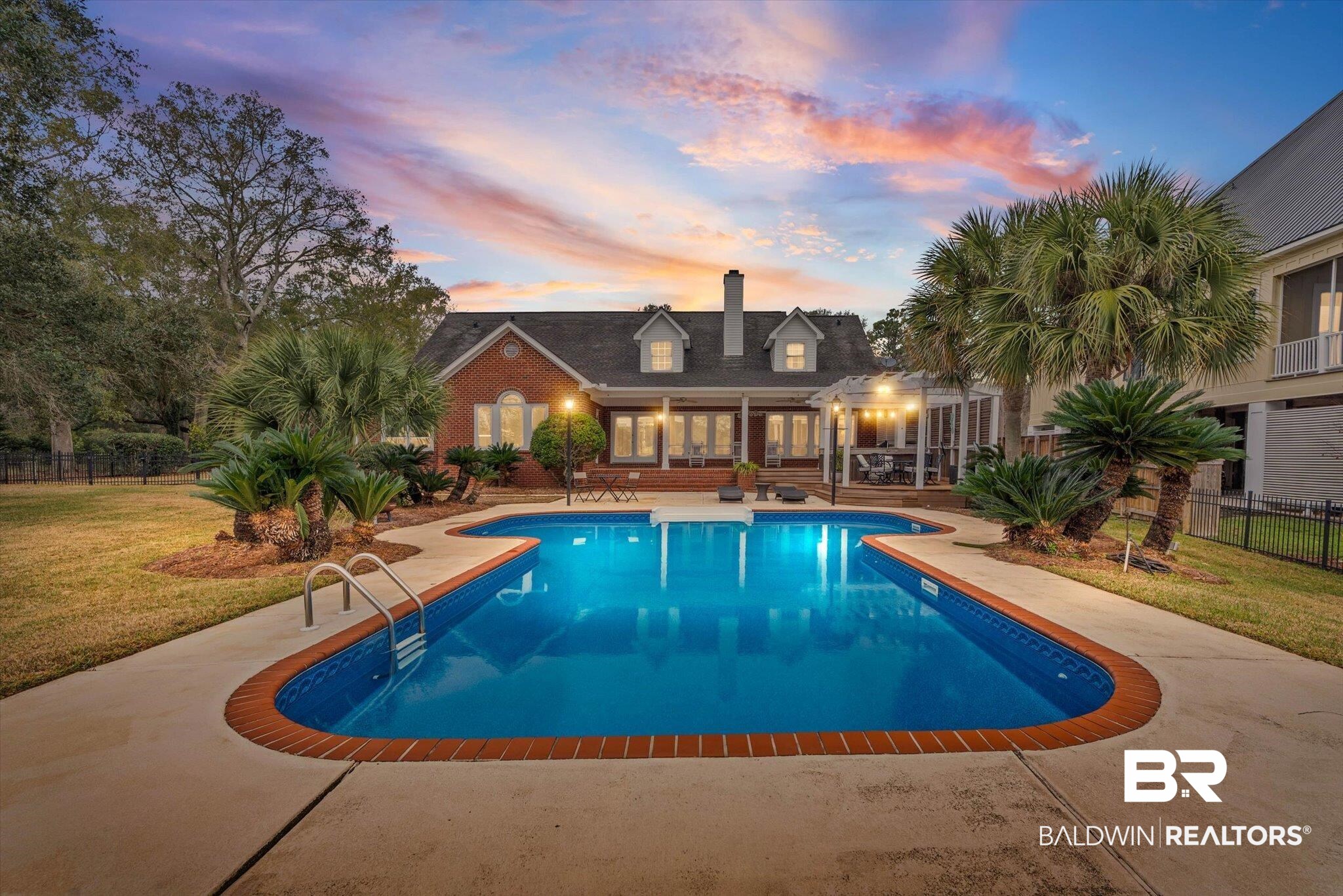 4851 Audubon Drive Mobile, AL 36619 - Photo 3 of 46 Pool at dusk with a patio area