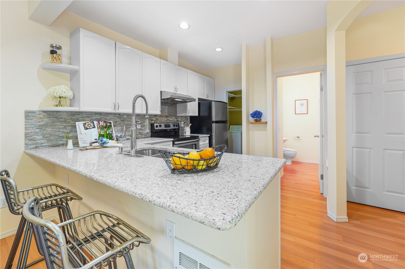 10909 Avondale Road Northeast, Unit K144 Redmond, WA 98052 - Photo 11 of 28 a kitchen with sink and view of living room