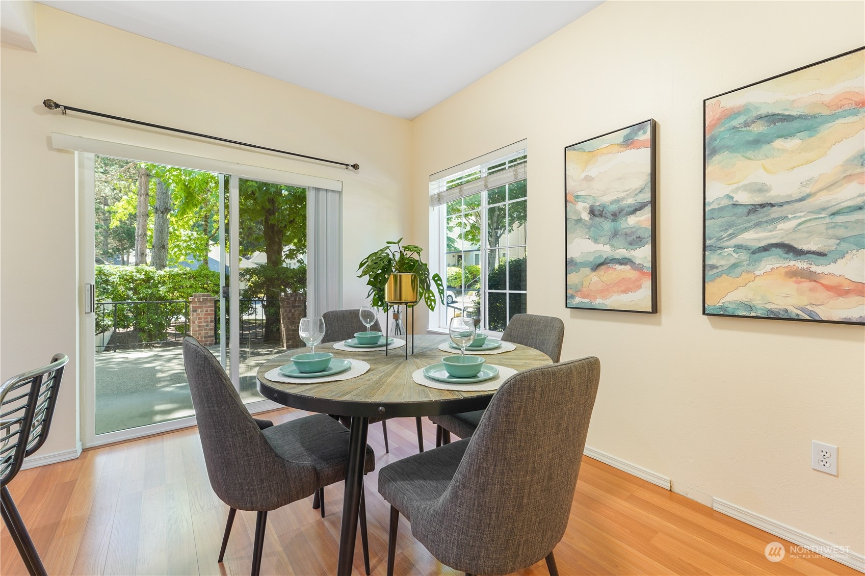 10909 Avondale Road Northeast, Unit K144 Redmond, WA 98052 - Photo 15 of 28 a dining room with furniture large windows and wooden floor