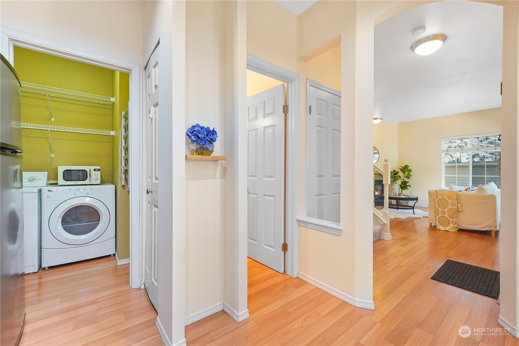 10909 Avondale Road Northeast, Unit K144 Redmond, WA 98052 - Photo 16 of 28 a view of a hallway with bathroom and wooden floor