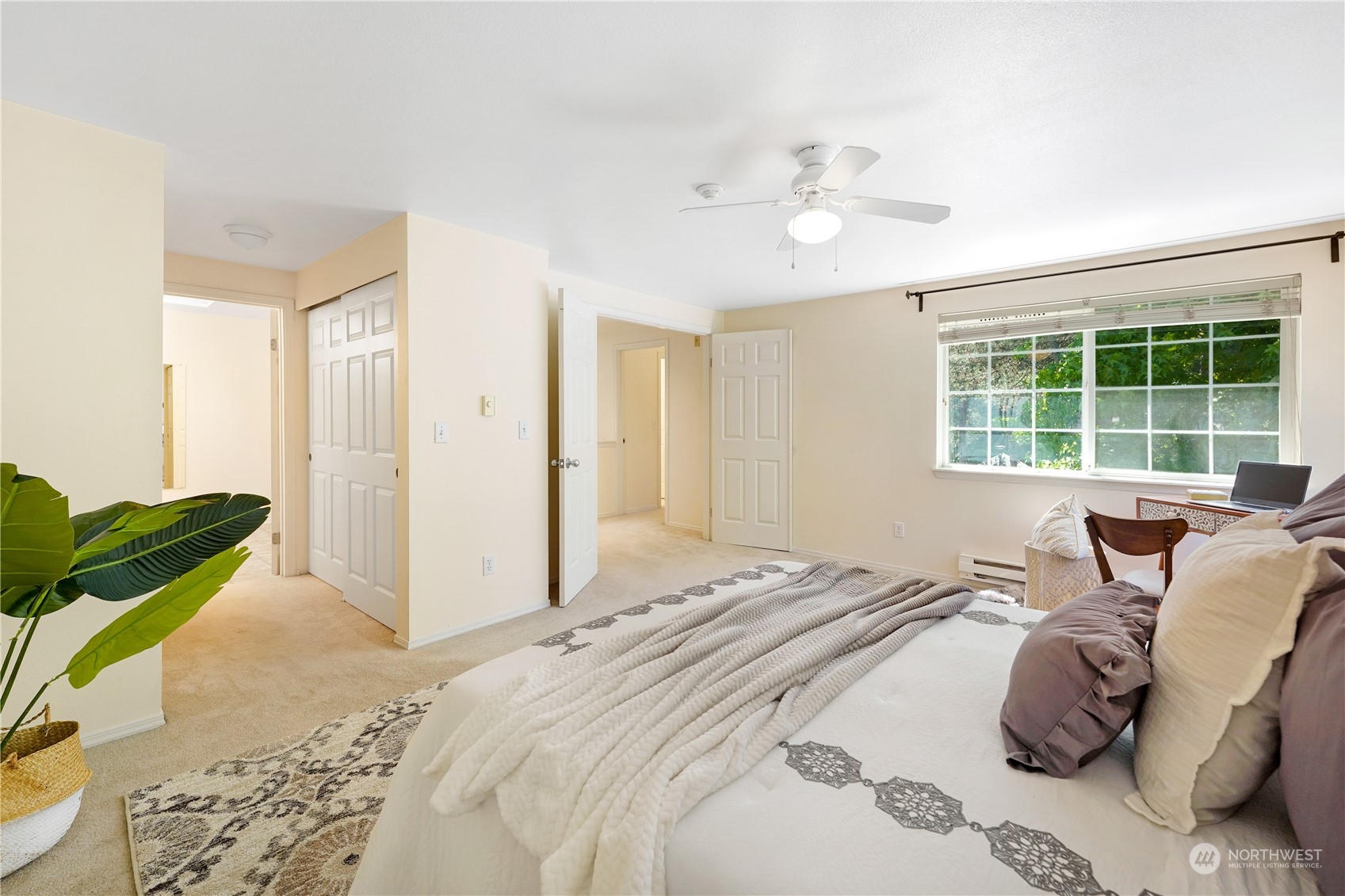10909 Avondale Road Northeast, Unit K144 Redmond, WA 98052 - Photo 20 of 28 a bedroom with a bed and a large window