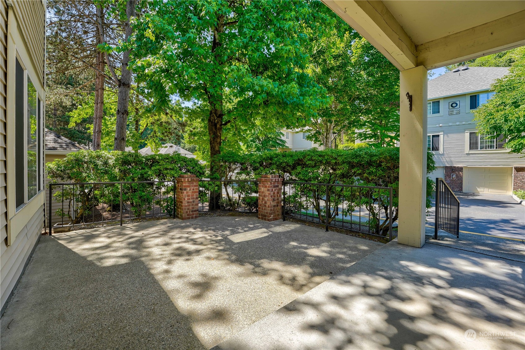10909 Avondale Road Northeast, Unit K144 Redmond, WA 98052 - Photo 2 of 28 a view of a outdoor space with a house