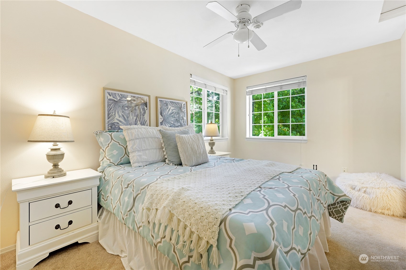 10909 Avondale Road Northeast, Unit K144 Redmond, WA 98052 - Photo 25 of 28 a bedroom with a bed and a window