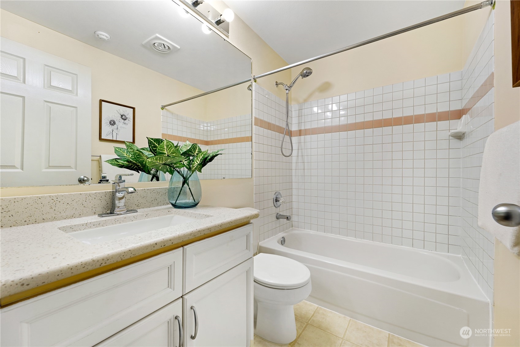 10909 Avondale Road Northeast, Unit K144 Redmond, WA 98052 - Photo 27 of 28 a bathroom with a granite countertop sink a toilet and shower