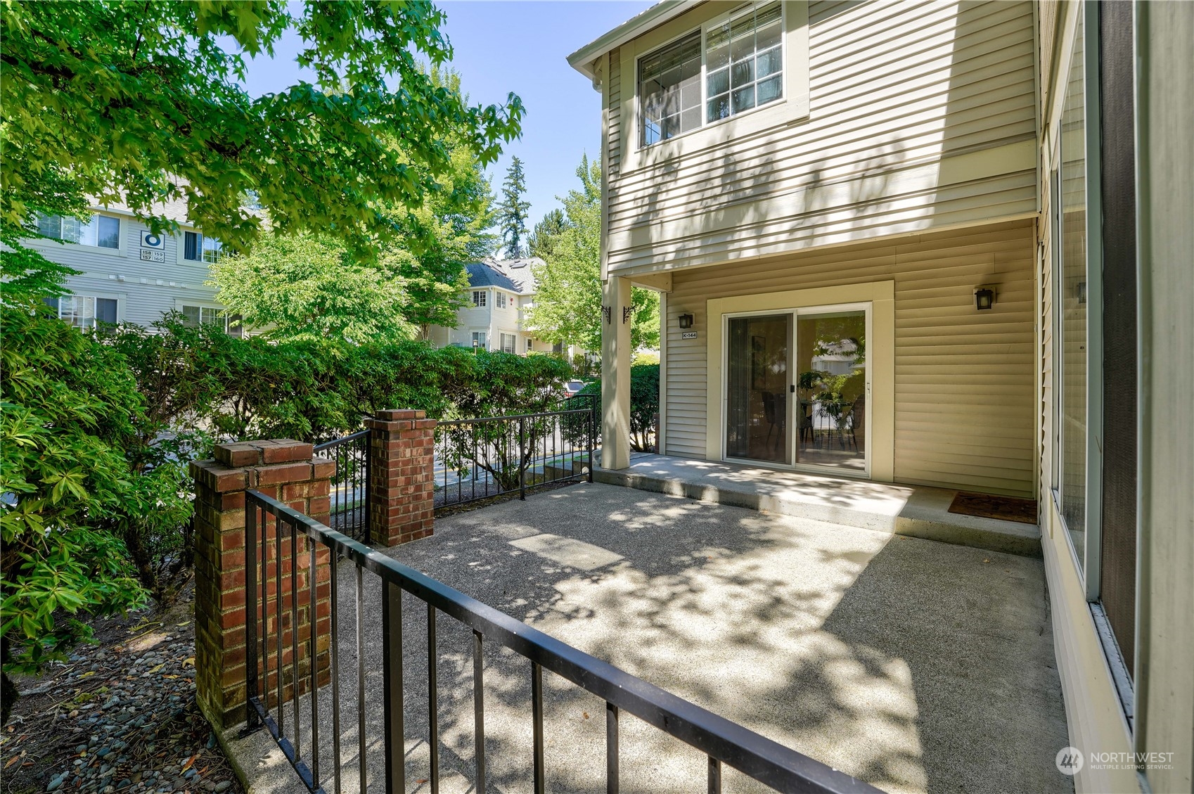 10909 Avondale Road Northeast, Unit K144 Redmond, WA 98052 - Photo 4 of 28 a view of a house with backyard
