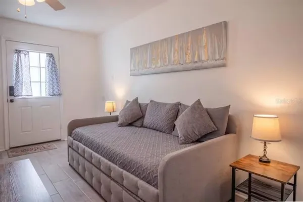 a bedroom with a bed and a window