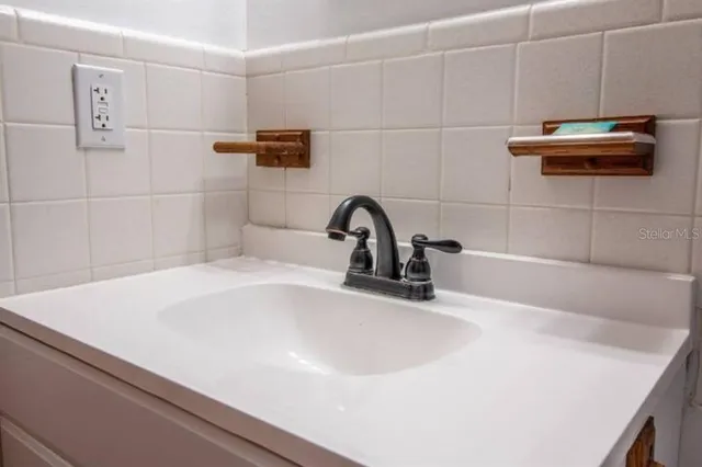 a bathroom with a sink and a bathtub