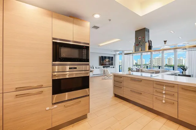 a bedroom with bed and a large window