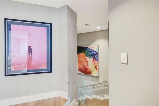 a living room with furniture and large window