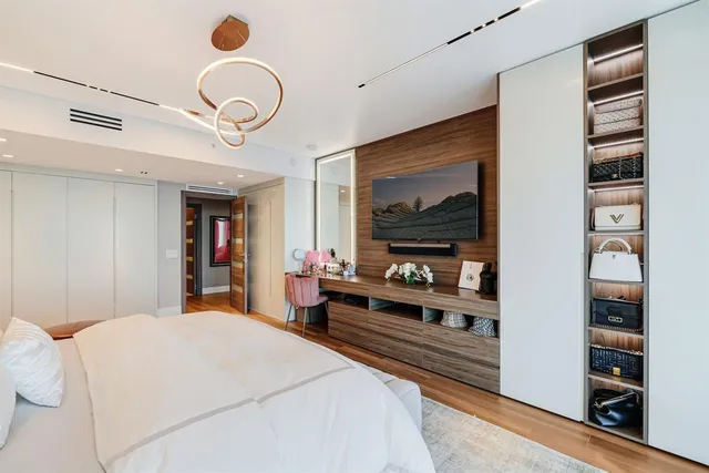 a view of a balcony with couches and city view