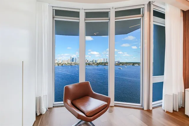 a view of entryway livingroom and hall with wooden floor