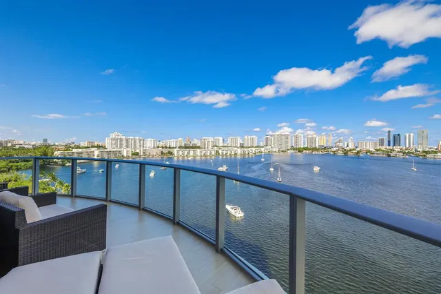 a view of a balcony with lake view and mountain view
