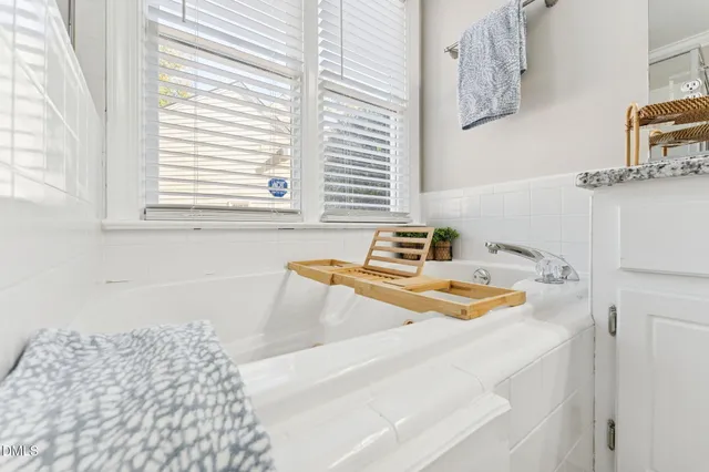 a bathroom with a sink and a window