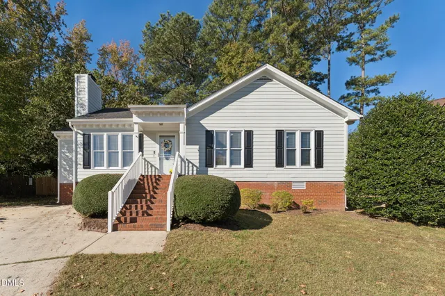 a view of a house with a yard and plants