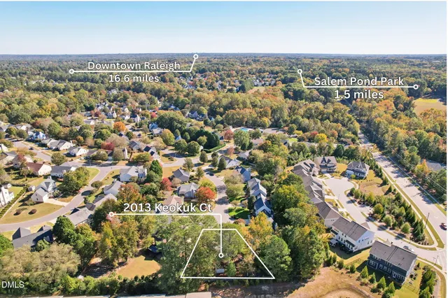 an aerial view of residential building with parking space