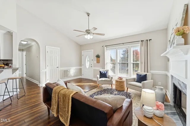 a living room with furniture fireplace and a flat screen tv