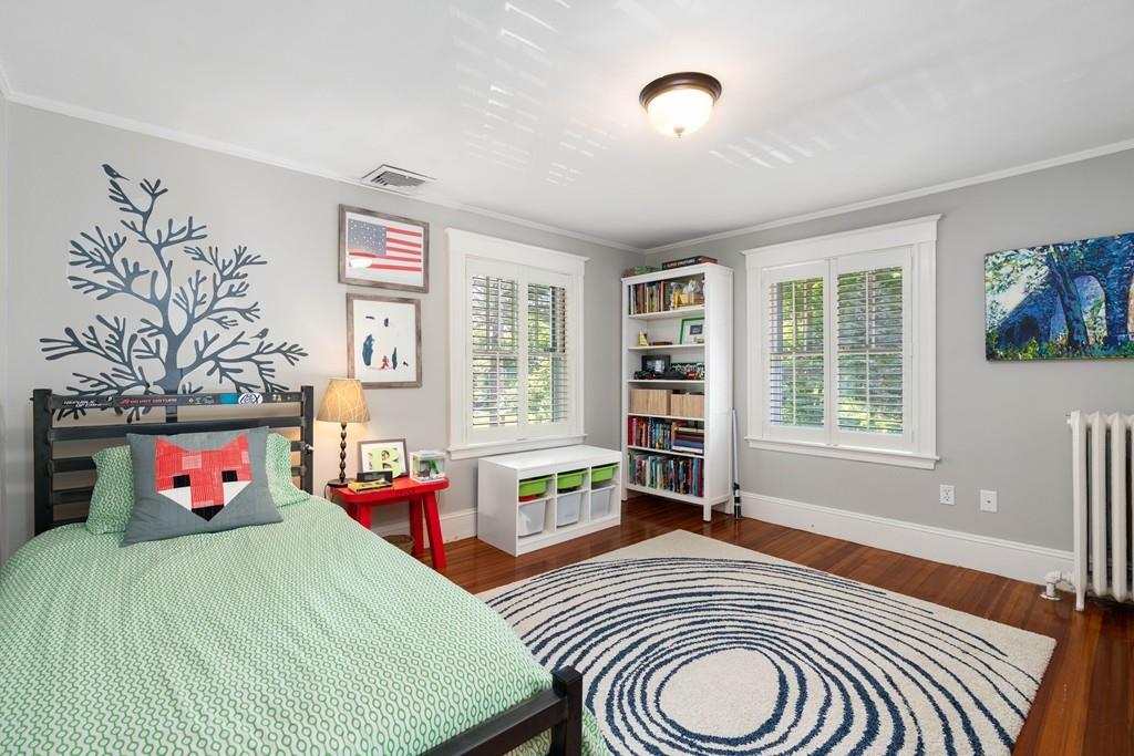 23 Glen Road Wellesley, MA 02481 - Photo 15 of 30 a bedroom with a bed a dresser and a large window