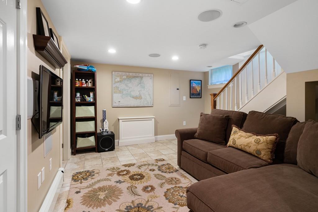 23 Glen Road Wellesley, MA 02481 - Photo 18 of 30 a living room with furniture ceiling fan and a rug