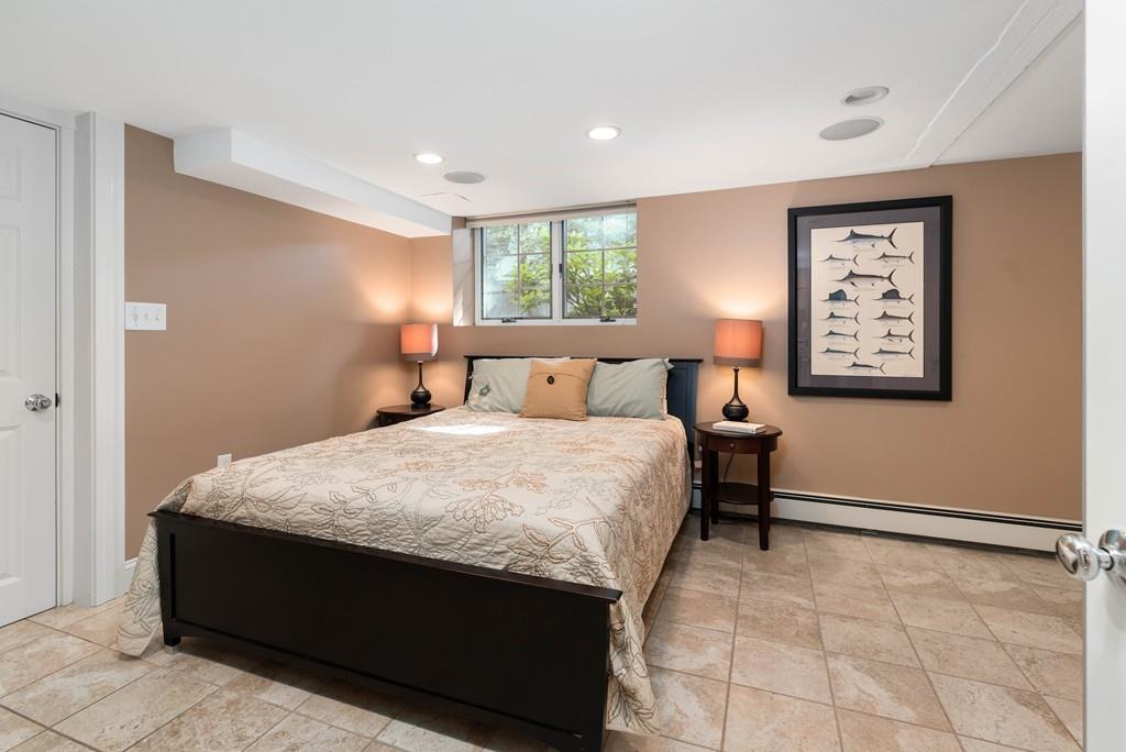 23 Glen Road Wellesley, MA 02481 - Photo 19 of 30 a bedroom with a bed and a window