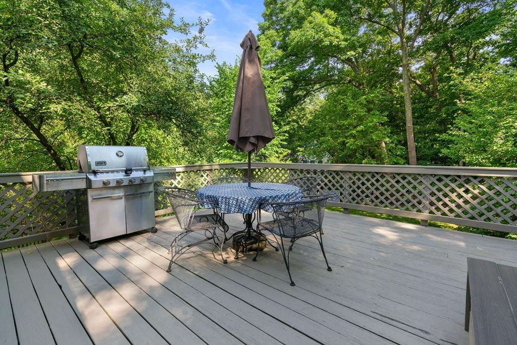 23 Glen Road Wellesley, MA 02481 - Photo 23 of 30 a view of a chairs and table on the wooden floor