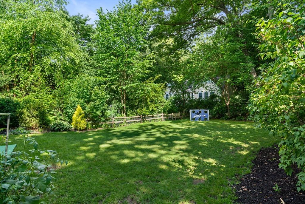23 Glen Road Wellesley, MA 02481 - Photo 3 of 30 a green field with lots of trees in it