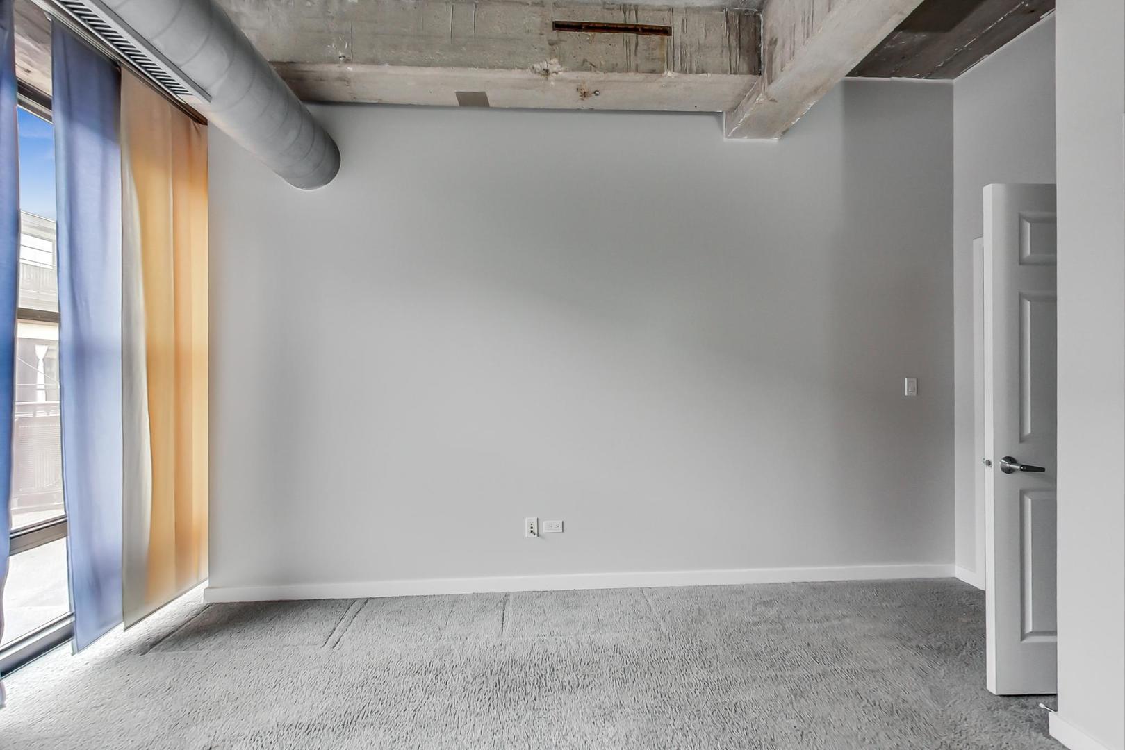 1069 West 14th Place, Unit 310 Chicago, IL 60608 - Photo 11 of 25 a view of an empty room