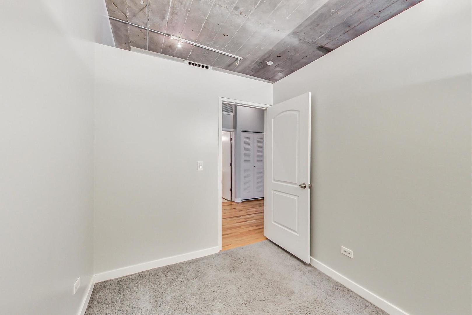 1069 West 14th Place, Unit 310 Chicago, IL 60608 - Photo 15 of 25 a view of an empty room