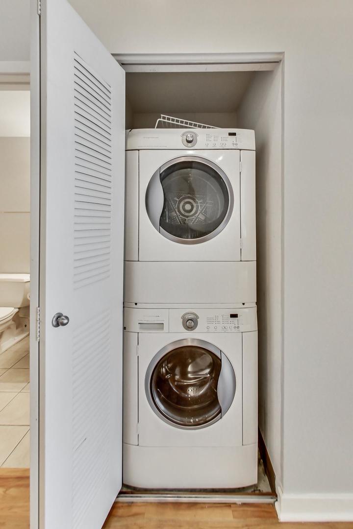 1069 West 14th Place, Unit 310 Chicago, IL 60608 - Photo 17 of 25 a utility room with dryer and washer