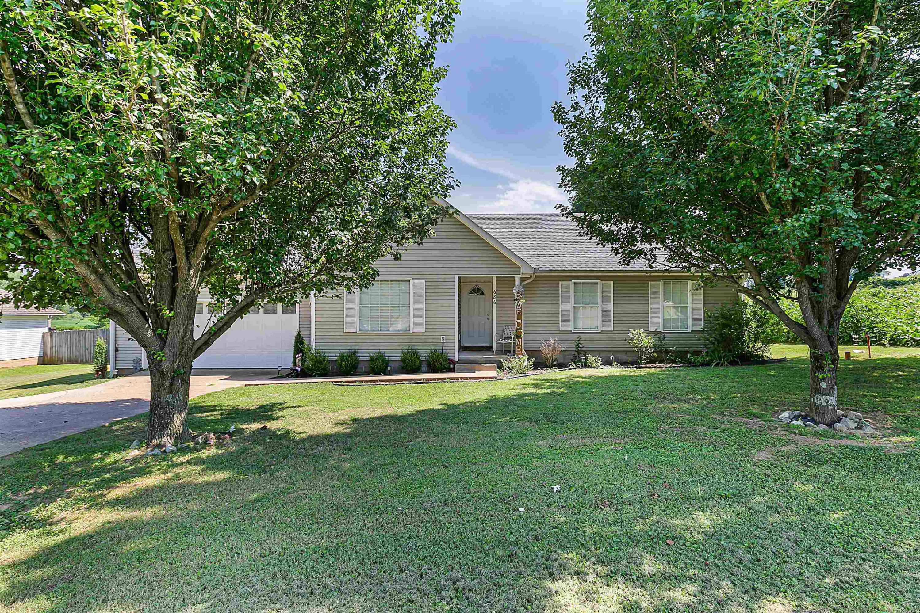 686 Gobelet Road Medon, TN 38356 - Photo 1 of 14 a front view of a house with a garden and trees