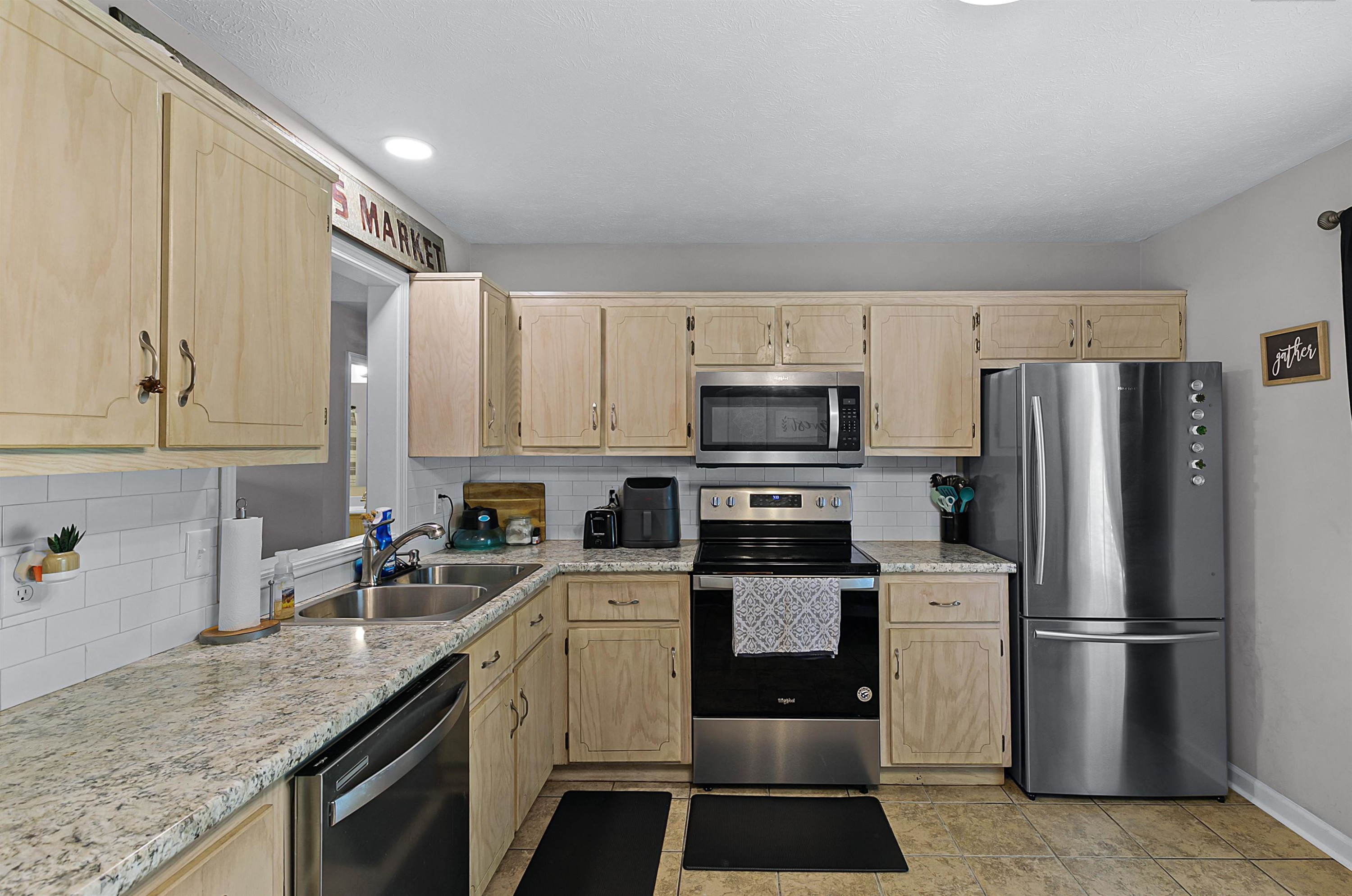 686 Gobelet Road Medon, TN 38356 - Photo 8 of 14 a kitchen with stainless steel appliances granite countertop a refrigerator sink and stove
