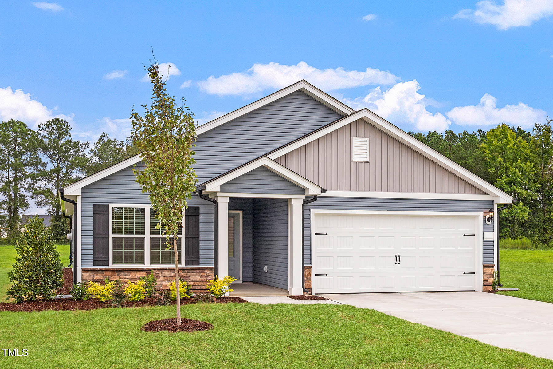 9080 Ava Drive Bailey, NC 27807 - Photo 2 of 20 a front view of a house with a yard and garage