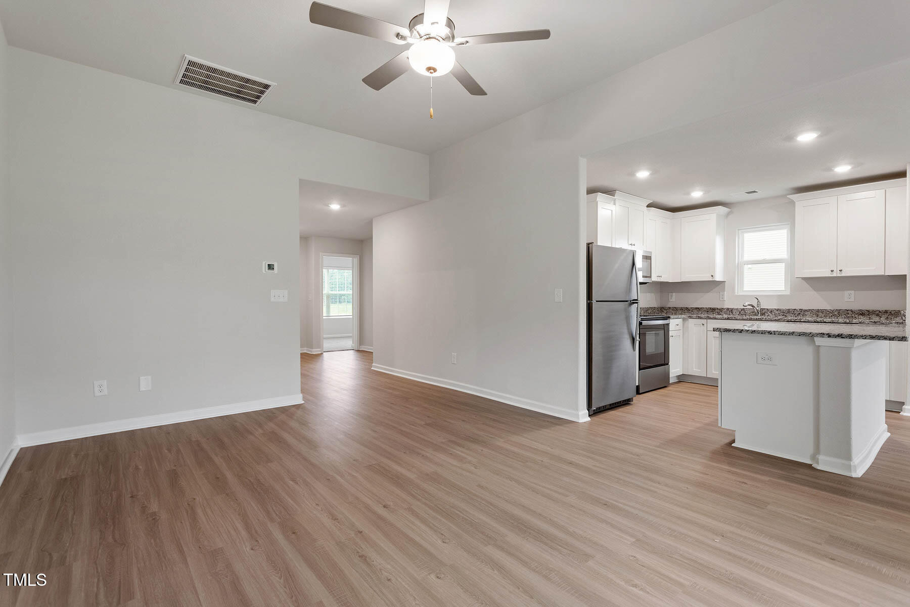 9080 Ava Drive Bailey, NC 27807 - Photo 5 of 20 a view of kitchen with granite countertop cabinets and refrigerator