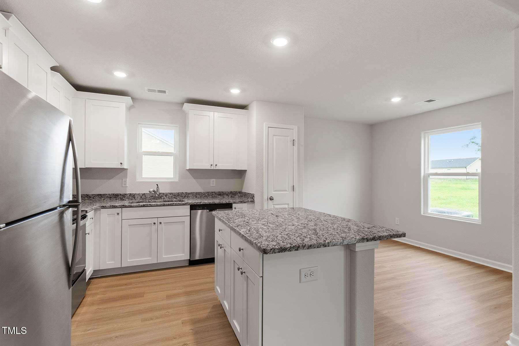 9080 Ava Drive Bailey, NC 27807 - Photo 6 of 20 a kitchen with granite countertop a sink stove and refrigerator