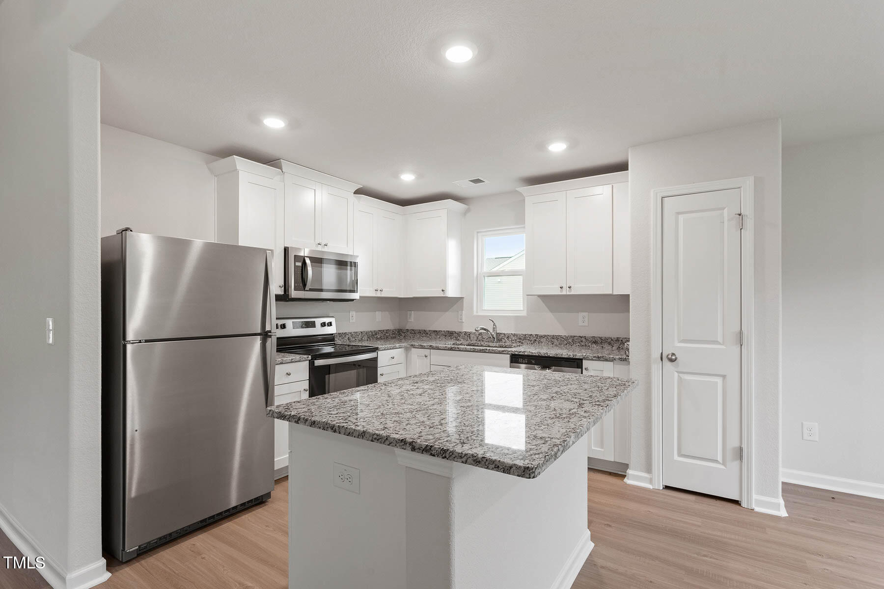 9080 Ava Drive Bailey, NC 27807 - Photo 7 of 20 a kitchen with stainless steel appliances granite countertop a refrigerator a stove a sink and a microwave