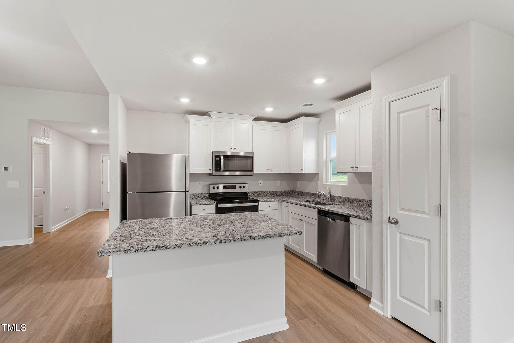 9080 Ava Drive Bailey, NC 27807 - Photo 8 of 20 a kitchen with stainless steel appliances granite countertop a refrigerator a stove top oven a sink and dishwasher