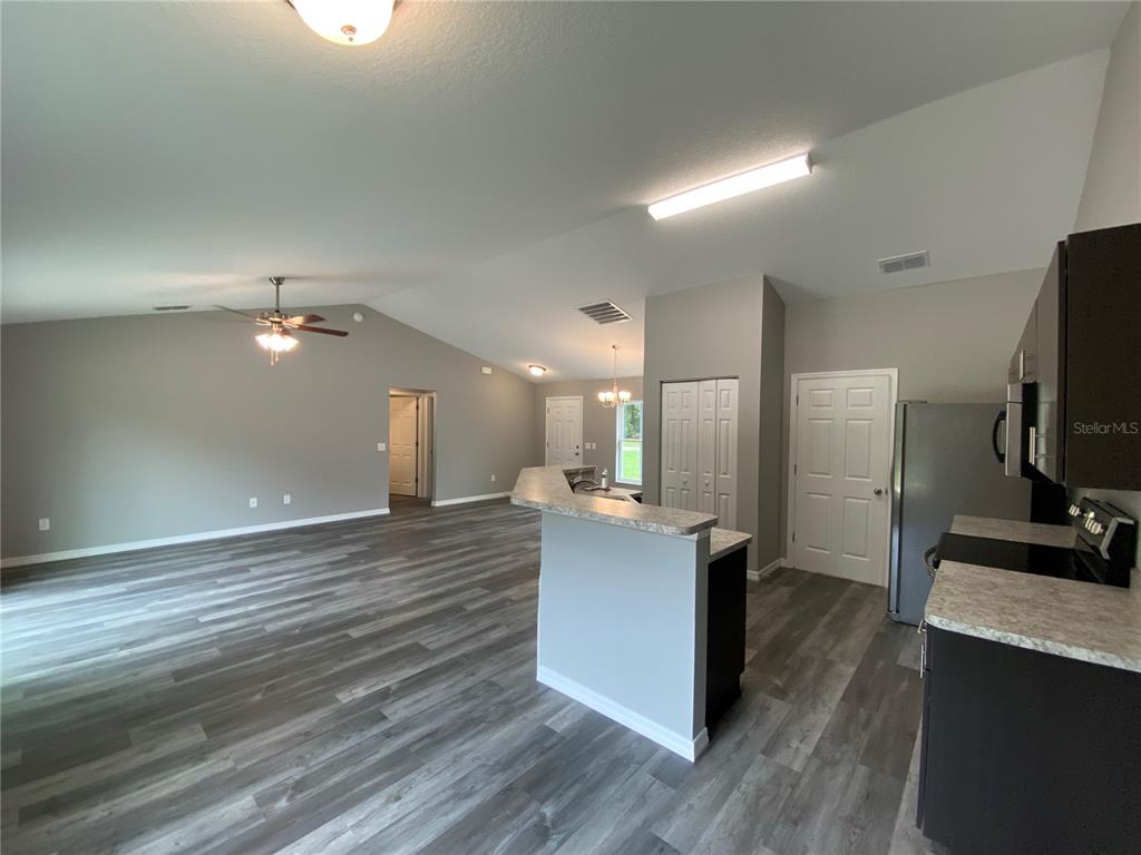 15945 Southwest 57th Terrace Road Ocala, FL 34473 - Photo 10 of 24 a view of a kitchen from the hallway