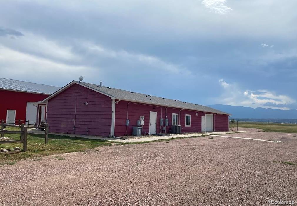 8648 Lake Davis Road Pueblo, CO 81005 - Photo 2 of 50 front view of a house with a yard