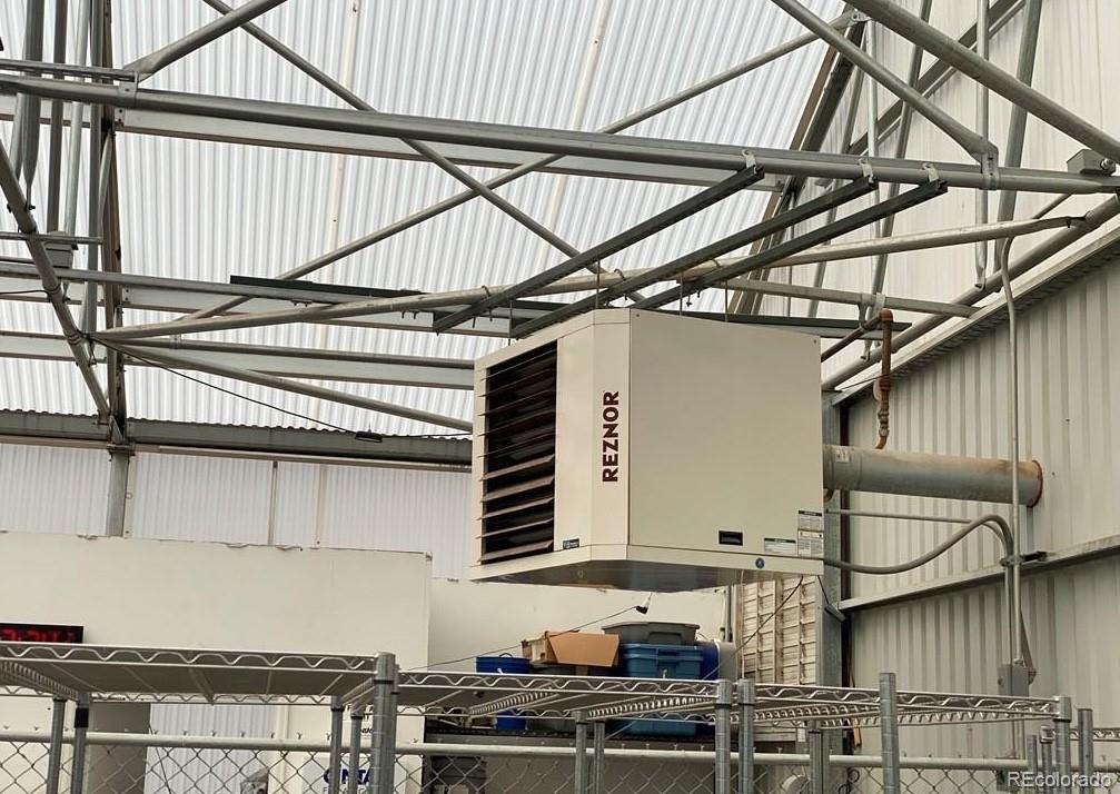 8648 Lake Davis Road Pueblo, CO 81005 - Photo 21 of 50 a view of a kitchen with furniture and wooden floor
