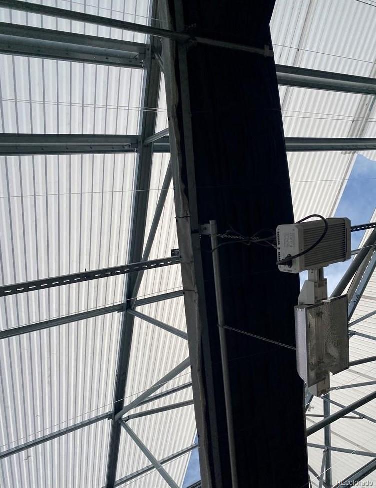 8648 Lake Davis Road Pueblo, CO 81005 - Photo 27 of 50 a view of staircase with lots of frames on wall