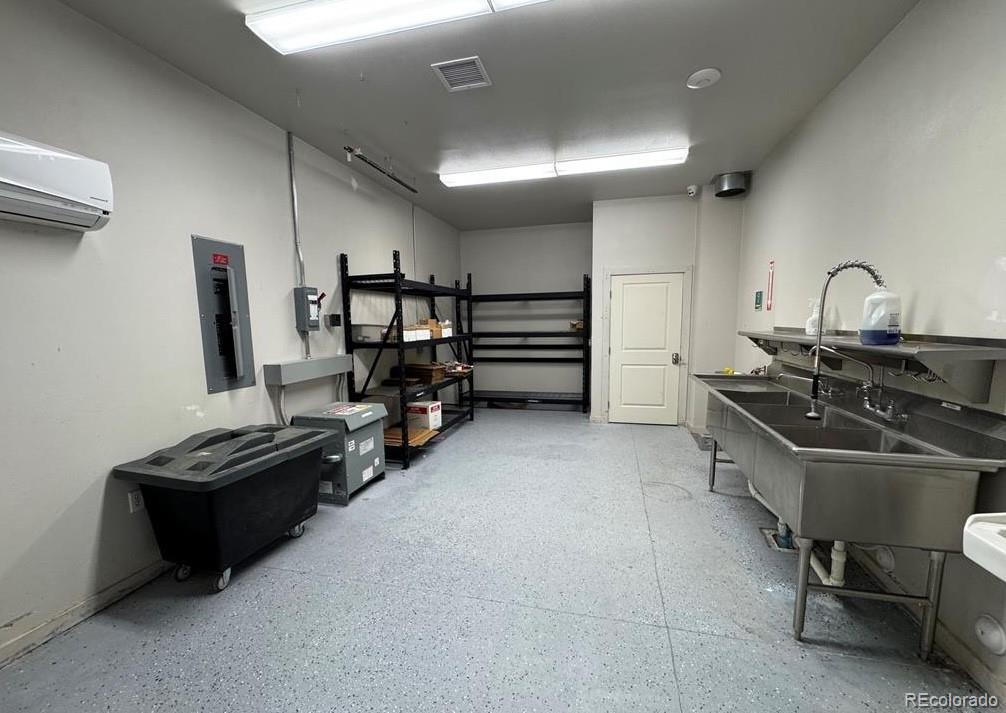 8648 Lake Davis Road Pueblo, CO 81005 - Photo 33 of 50 a kitchen with refrigerator and chairs