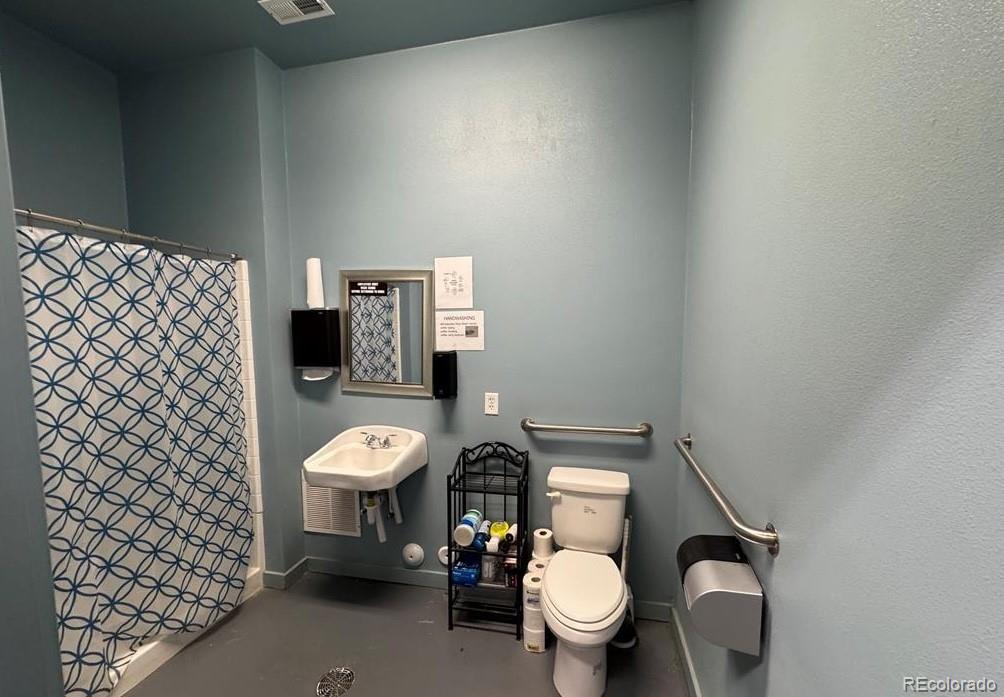8648 Lake Davis Road Pueblo, CO 81005 - Photo 35 of 50 a bathroom with a toilet and a sink