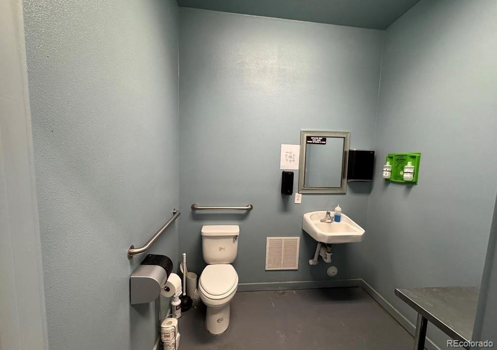8648 Lake Davis Road Pueblo, CO 81005 - Photo 36 of 50 a white toilet sitting next to a bathroom sink