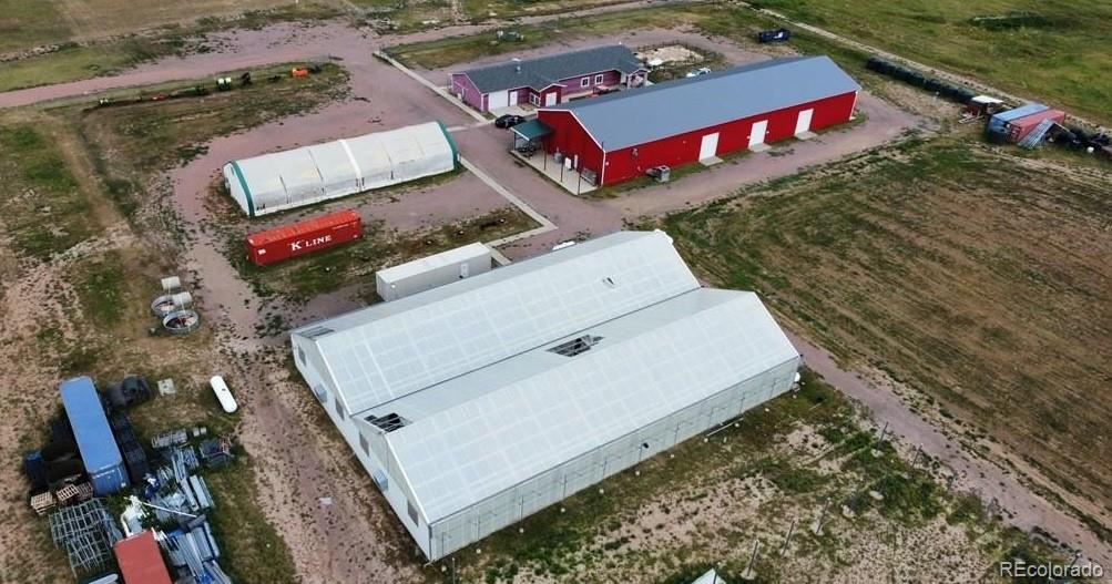 8648 Lake Davis Road Pueblo, CO 81005 - Photo 4 of 50 an aerial view of a house with a garden