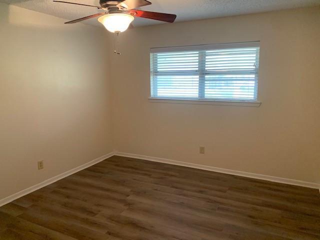 3104 South Lipsey Street Decatur, TX 76234 - Photo 12 of 18 a view of an empty room with wooden floor and a window