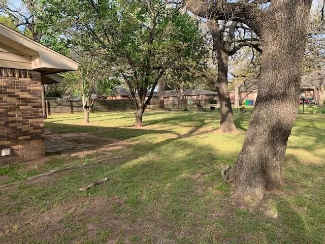 a view of a playground with basketball court