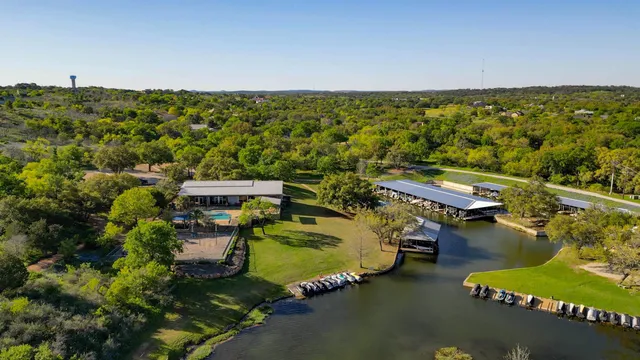 an aerial view of a house with a lake view