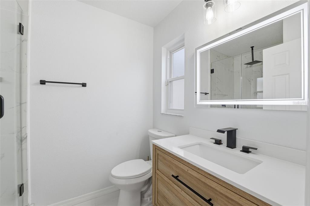 8025 San Fernando Drive Port Richey, FL 34668 - Photo 15 of 22 a bathroom with a sink and a toilet